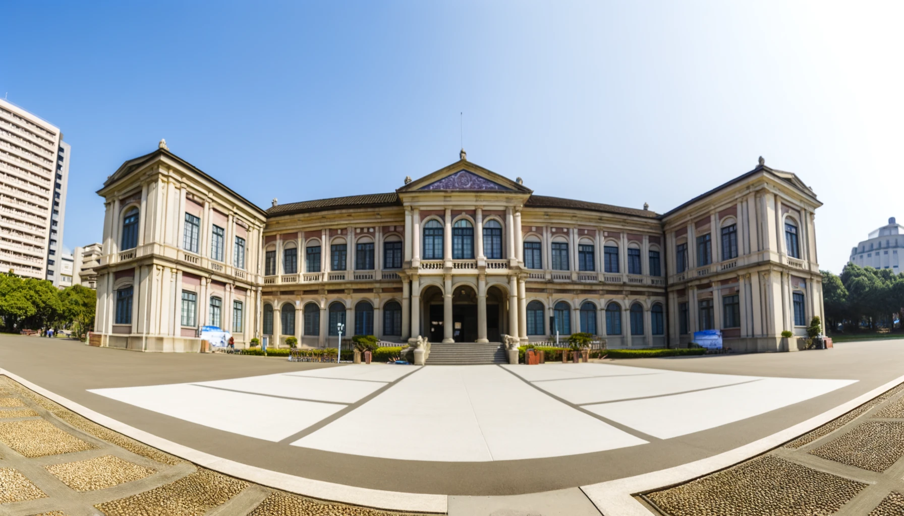 Classic architecture with ornate columns and large windows, exuding grandeur and civic importance.