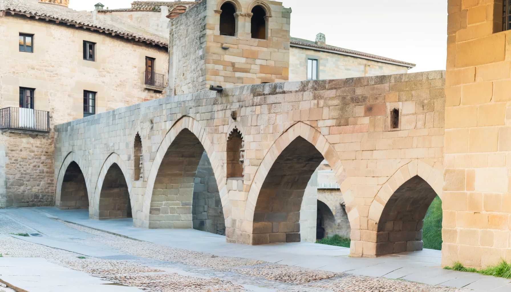 Ancient bridges featuring arches and intricate carvings.