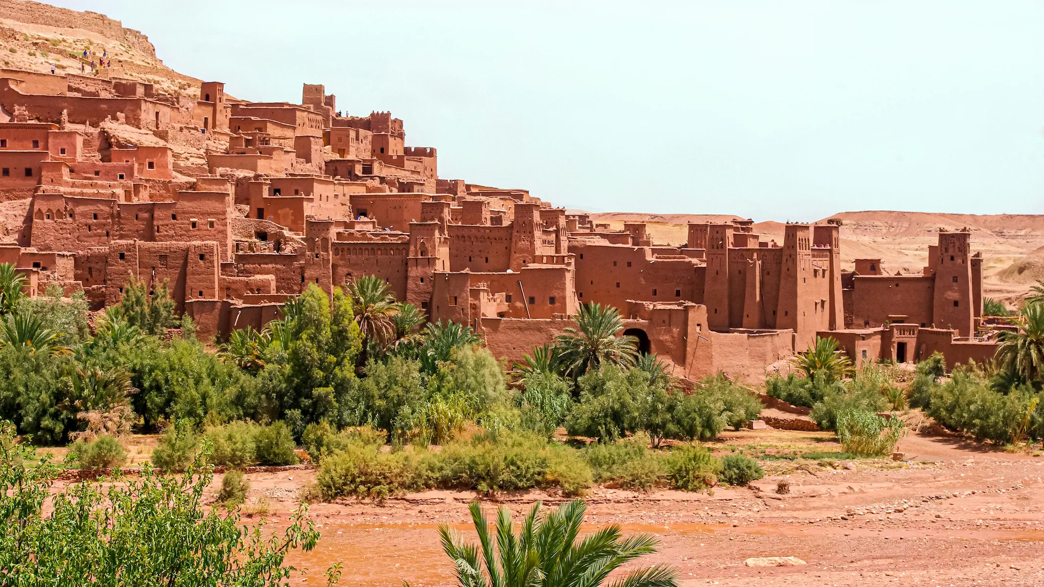 Ait Benhaddou, an ancient city in Morocco, built with vernacular clay materials in a desert setting.