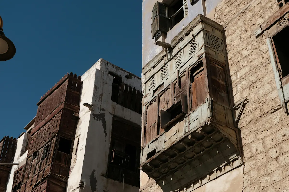 Historical architecture in Al Balad, Jeddah, featuring traditional mashrabiya windows and intricate designs.