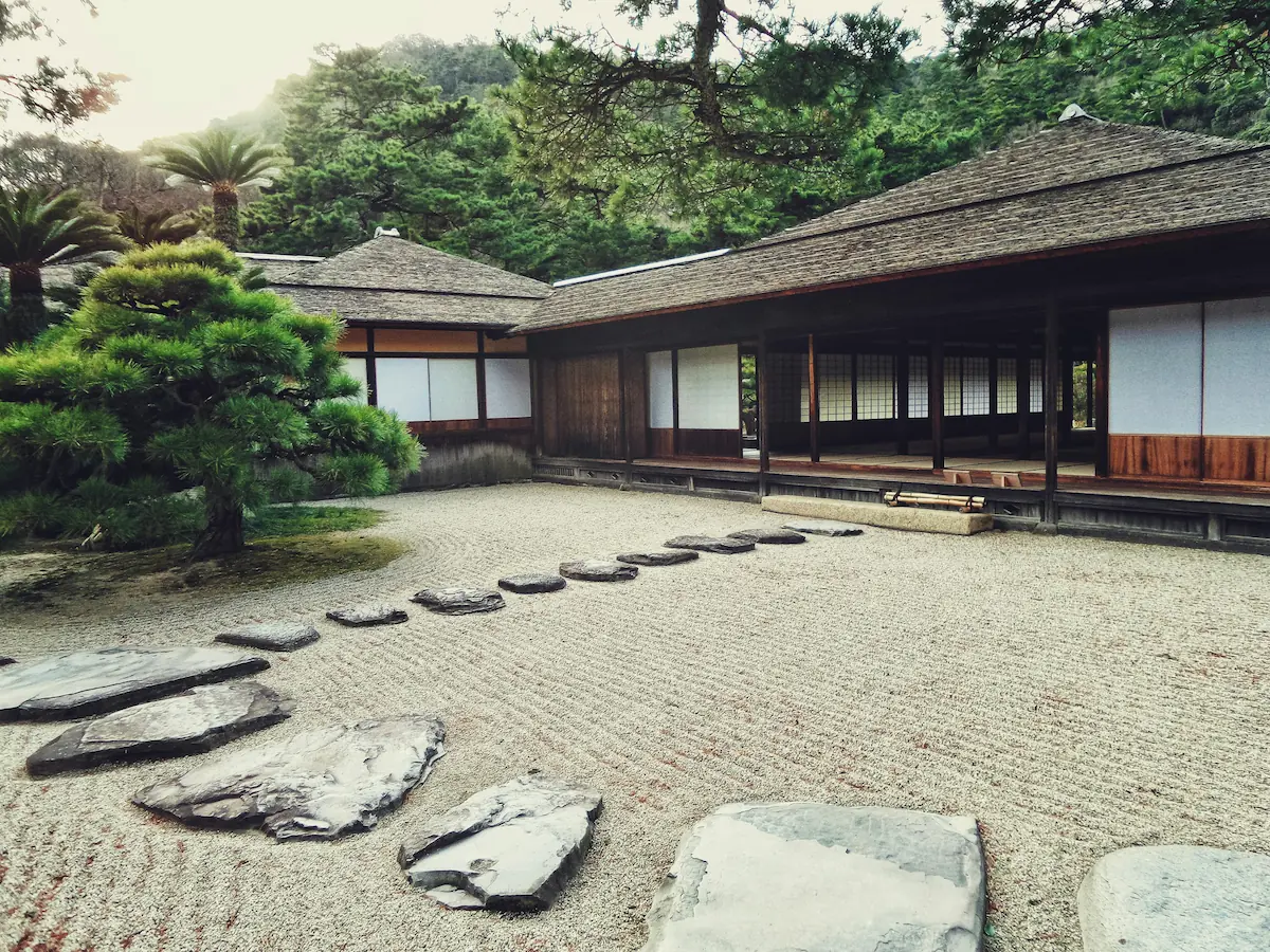 A bamboo house in Japan constructed with vernacular materials, blending sustainability with traditional building methods.