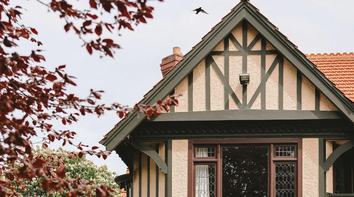 A charming Tudor-style house built in 1880 showcases classic architectural details.