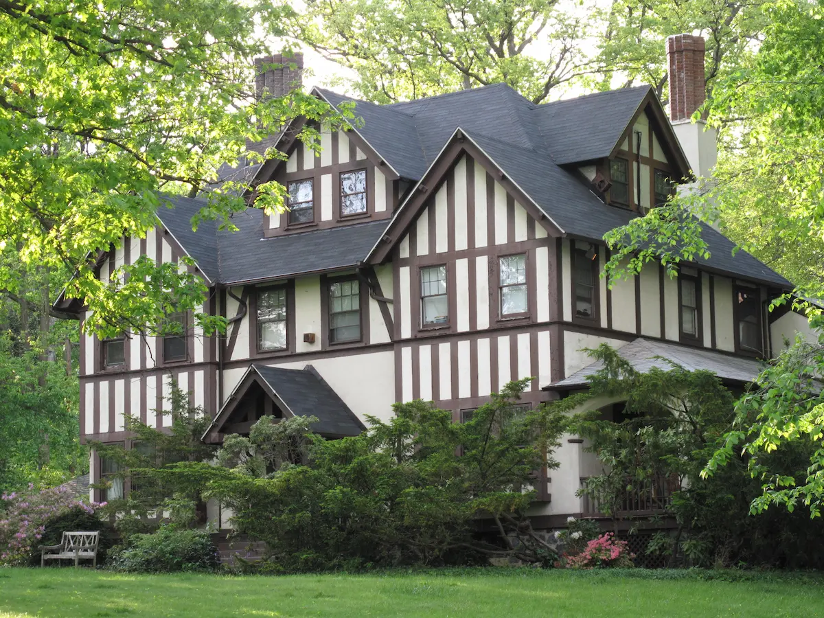 Classic Tudor-style home with steep gables and decorative half-timbering.