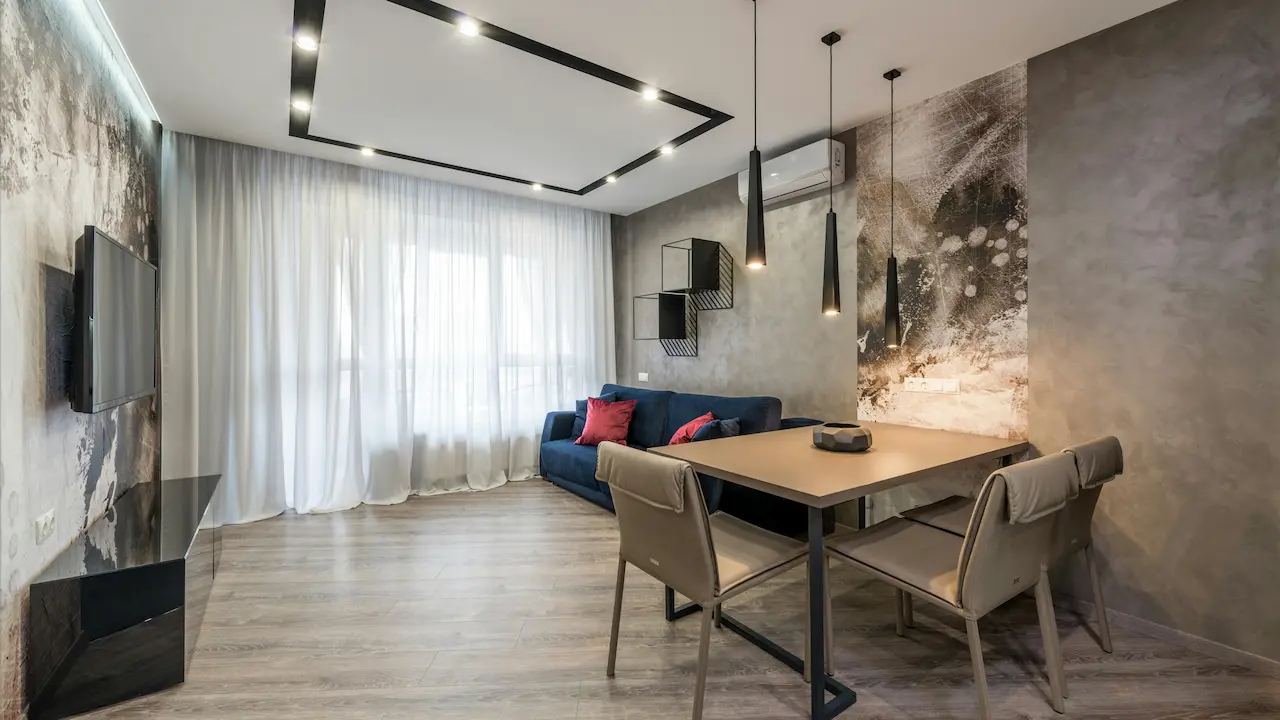 Living room with a soft couch and dining table, all in the same color for a bold, unified look.