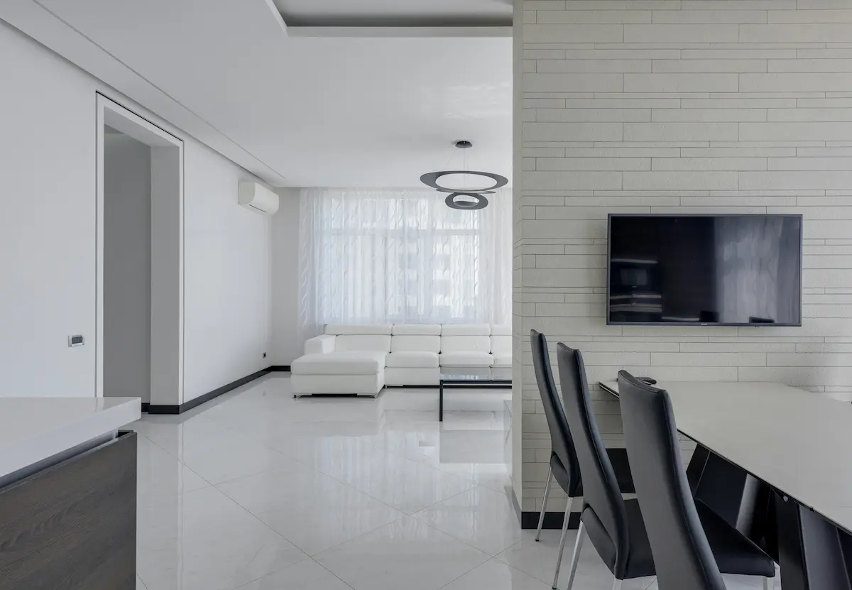 Contemporary furniture and minimalist design in a light-filled apartment with stylish lighting.