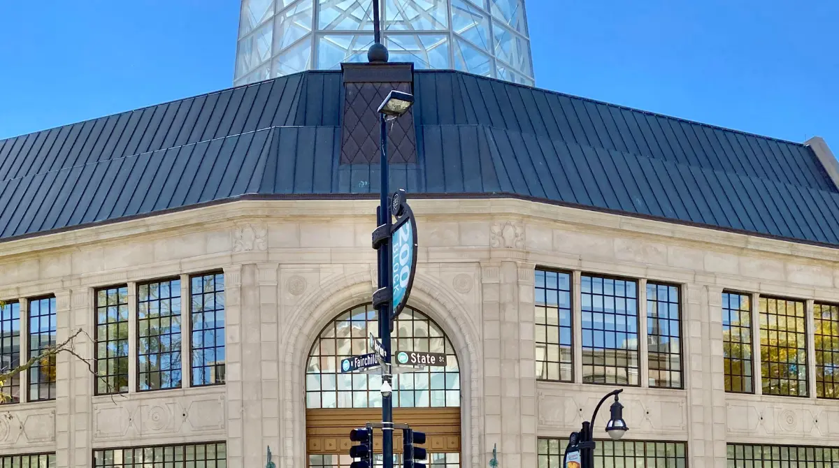 Department store building featuring a bonnet roof line, with a double-sloped design