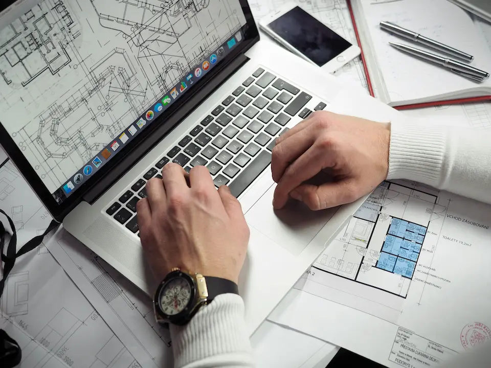 Freelance architect working on his laptop.