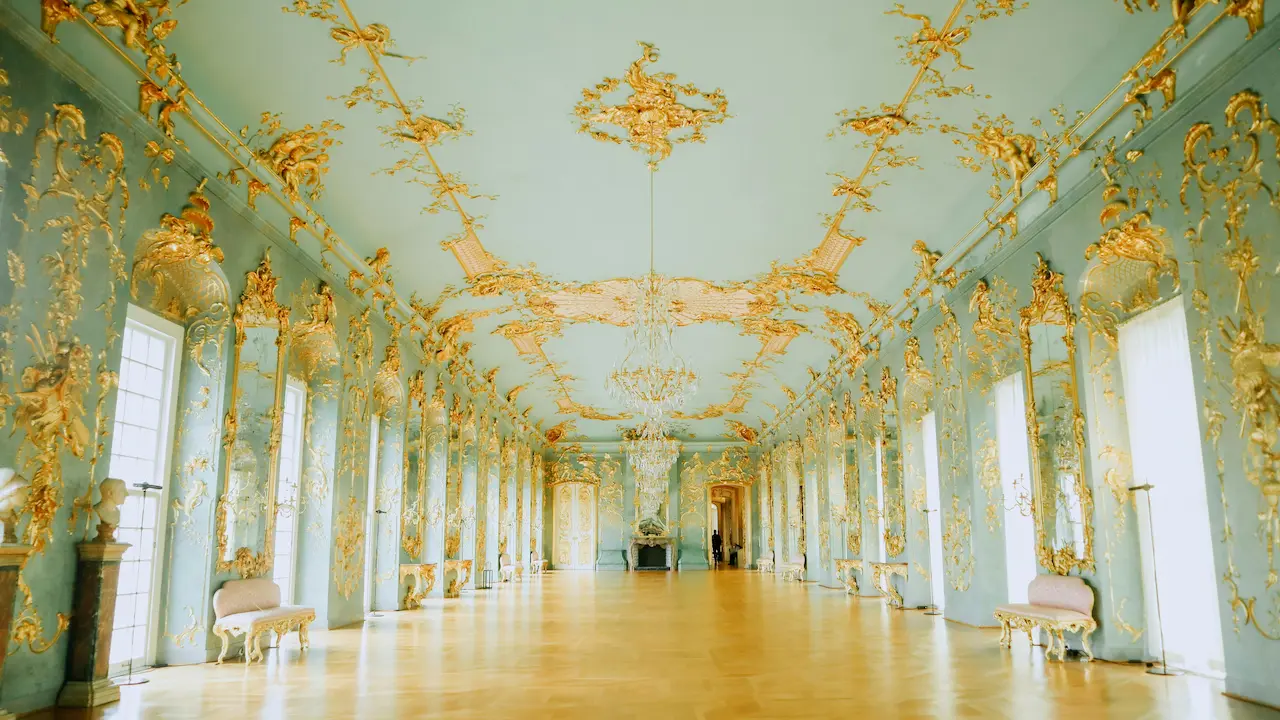 Elegant golden ceiling in a spacious room at Charlottenburg Palace, Berlin.