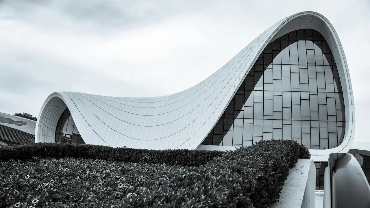 a fluid, innovative building in Baku with seamless curves blending architecture and landscape