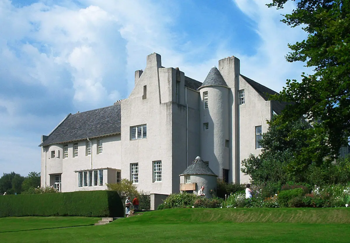 Hill House in Helensburgh, Scotland, designed by Charles Rennie Mackintosh, blends Art Nouveau with Arts and Crafts simplicity.
