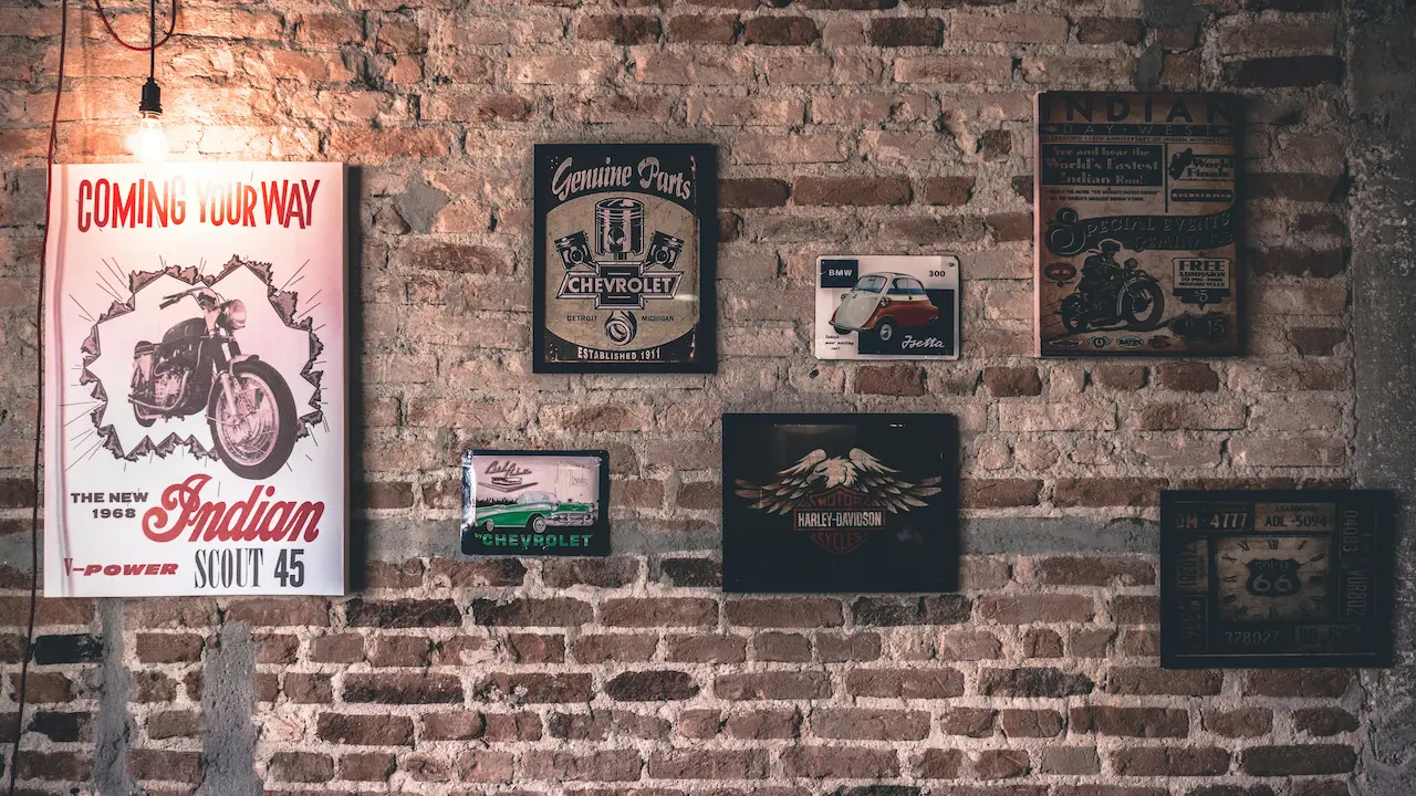 Several industrial art posters on the wall.
