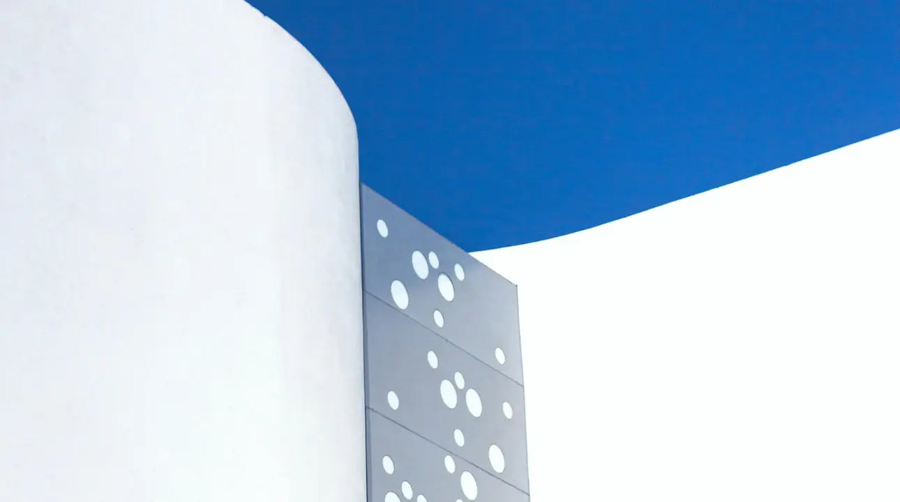 A modern building facade showcasing cutting-edge design and innovative materials, with a focus on futuristic architecture.