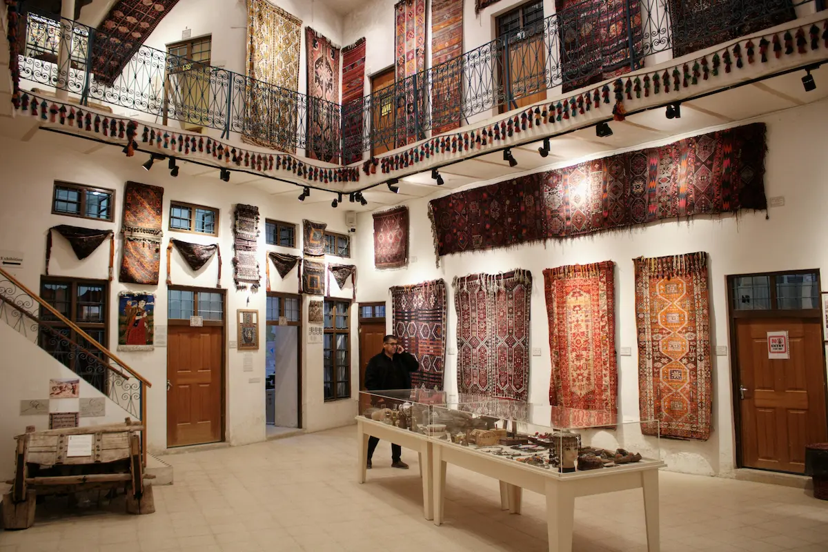 An exhibition of carpets in Iraq showcasing the art and craft style with intricate designs.