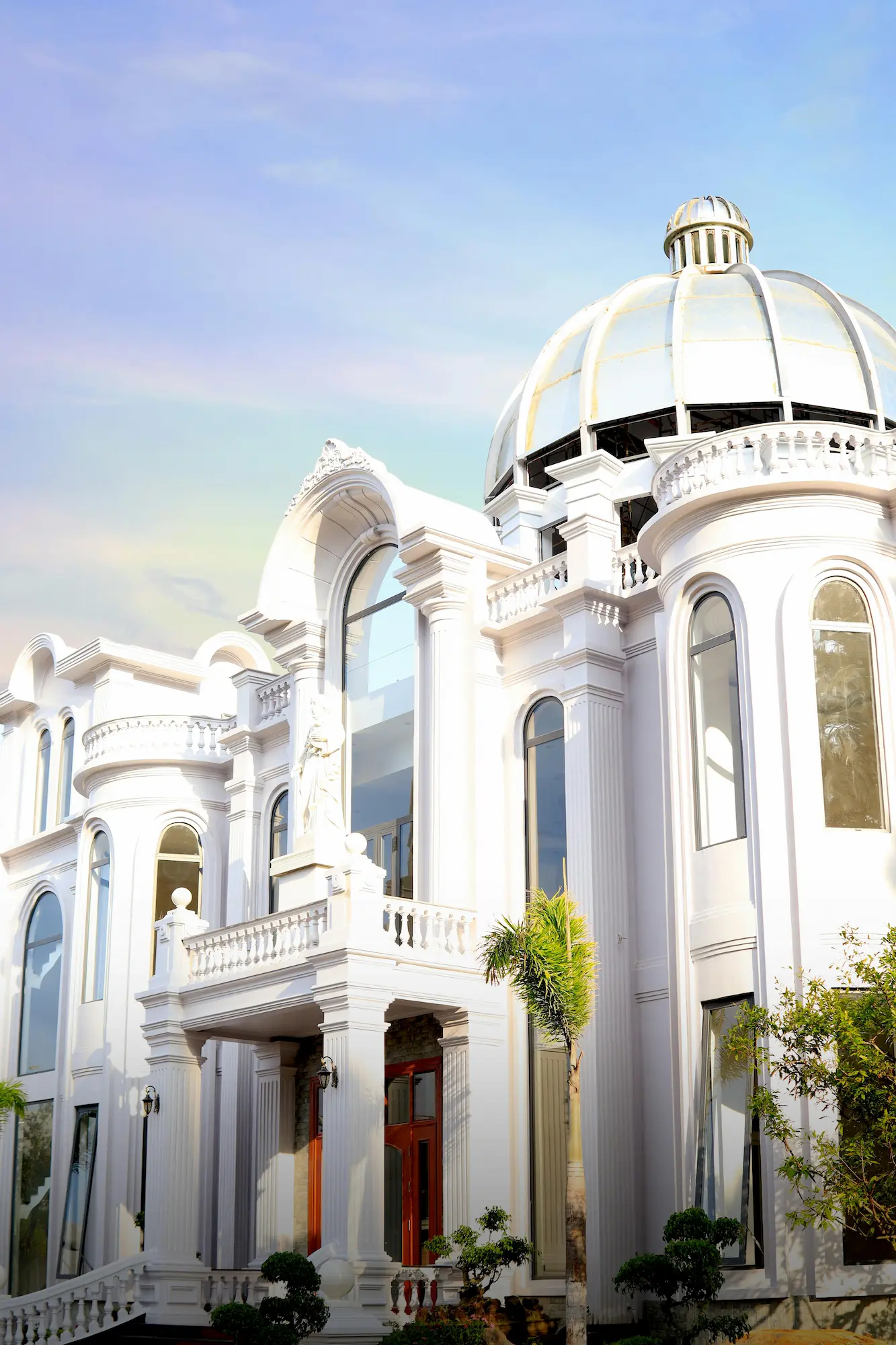 luxurious mansion with a dome designed in Italianate style, featuring grand architecture