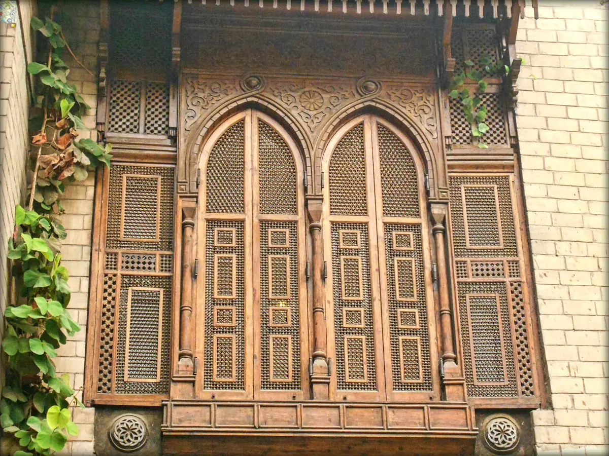 Traditional mashrabiya applications, emphasizing its use in Islamic architecture for privacy, ventilation, and decorative purposes.