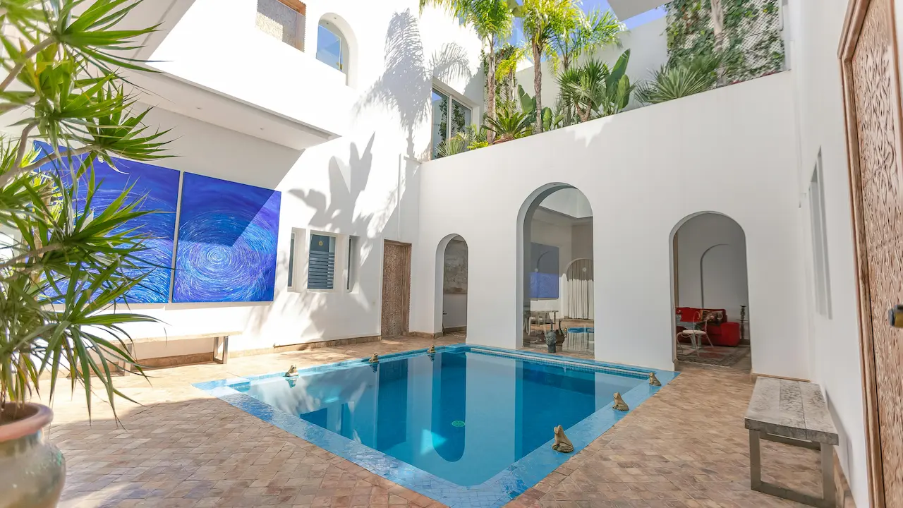 mediterranean-style house patio in Rabat, Morocco, featuring a swimming pool and elegant design elements