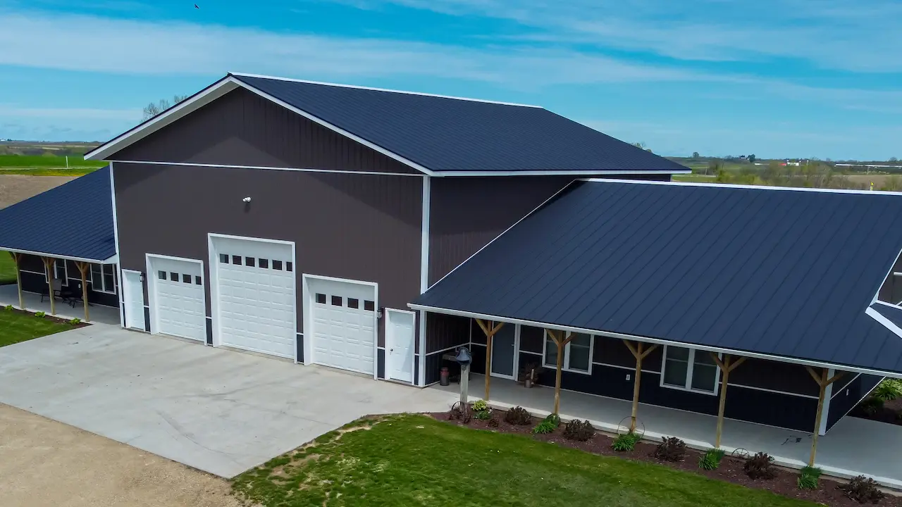 clean and modern wide barndominium with sleek design
