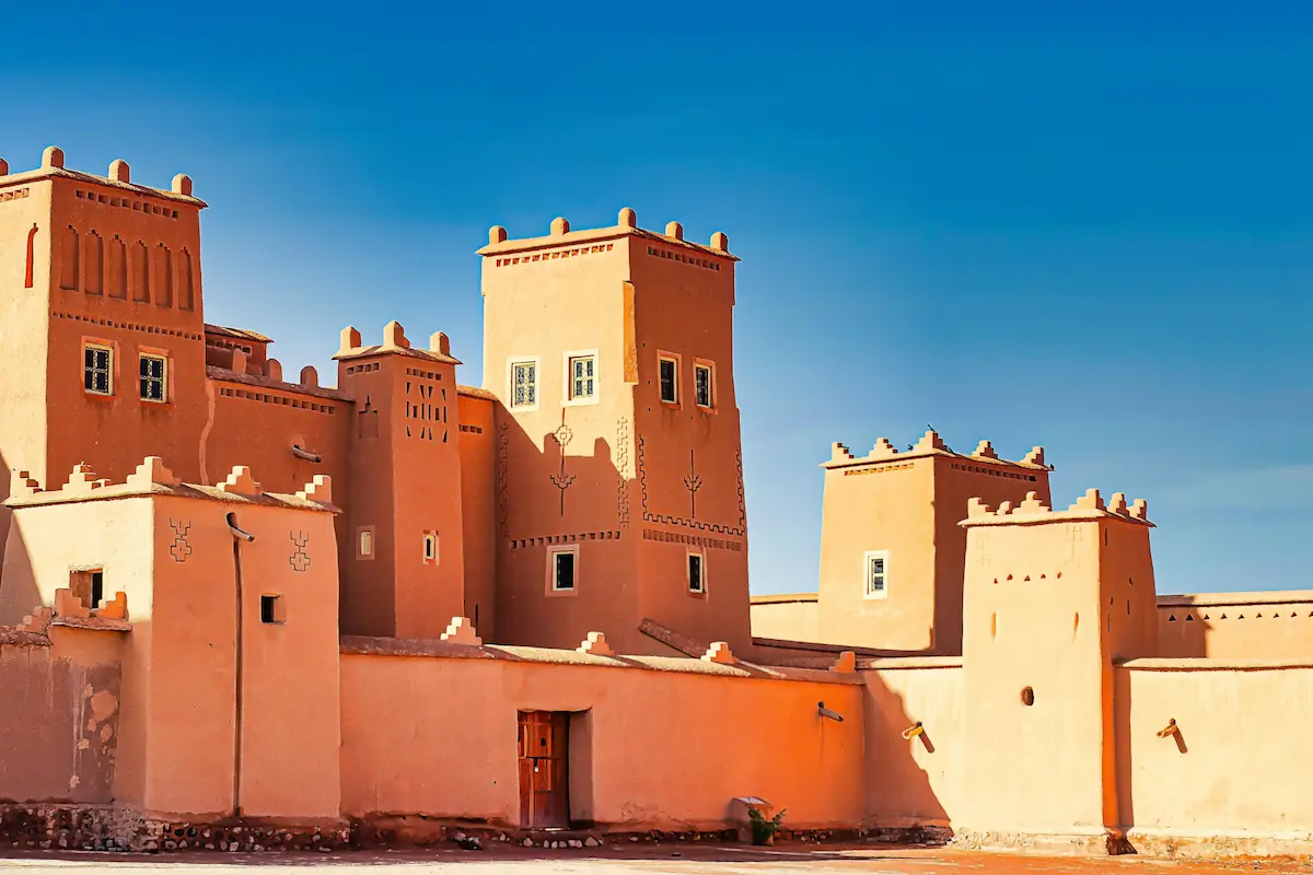 An old traditional city fortress in Morocco's desert, constructed with mud and clay vernacular materials.
