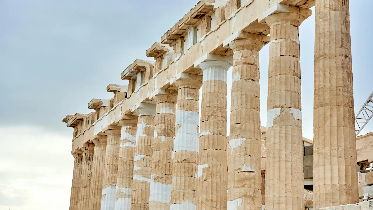 The Parthenon in Athens, Greece, showcasing the classical Doric style with its iconic columns and symmetry.