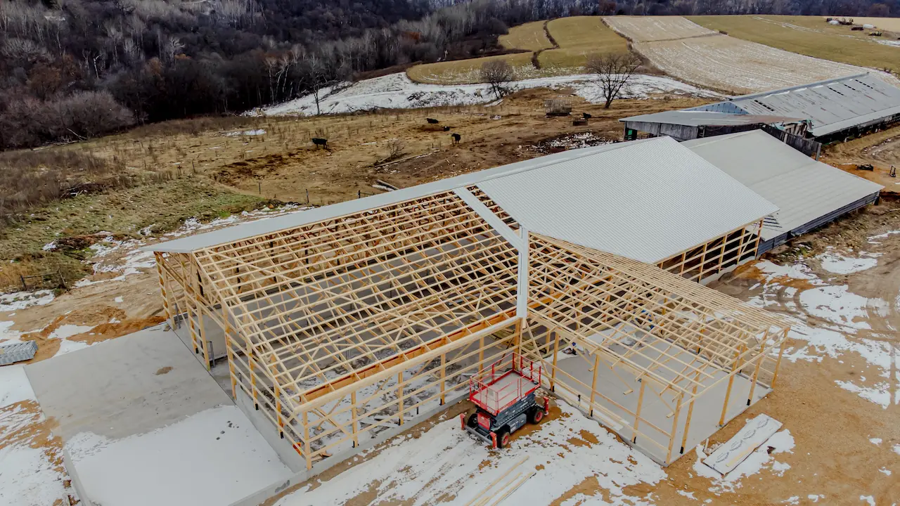 huge post-frame barn under construction, showing the structure in progress