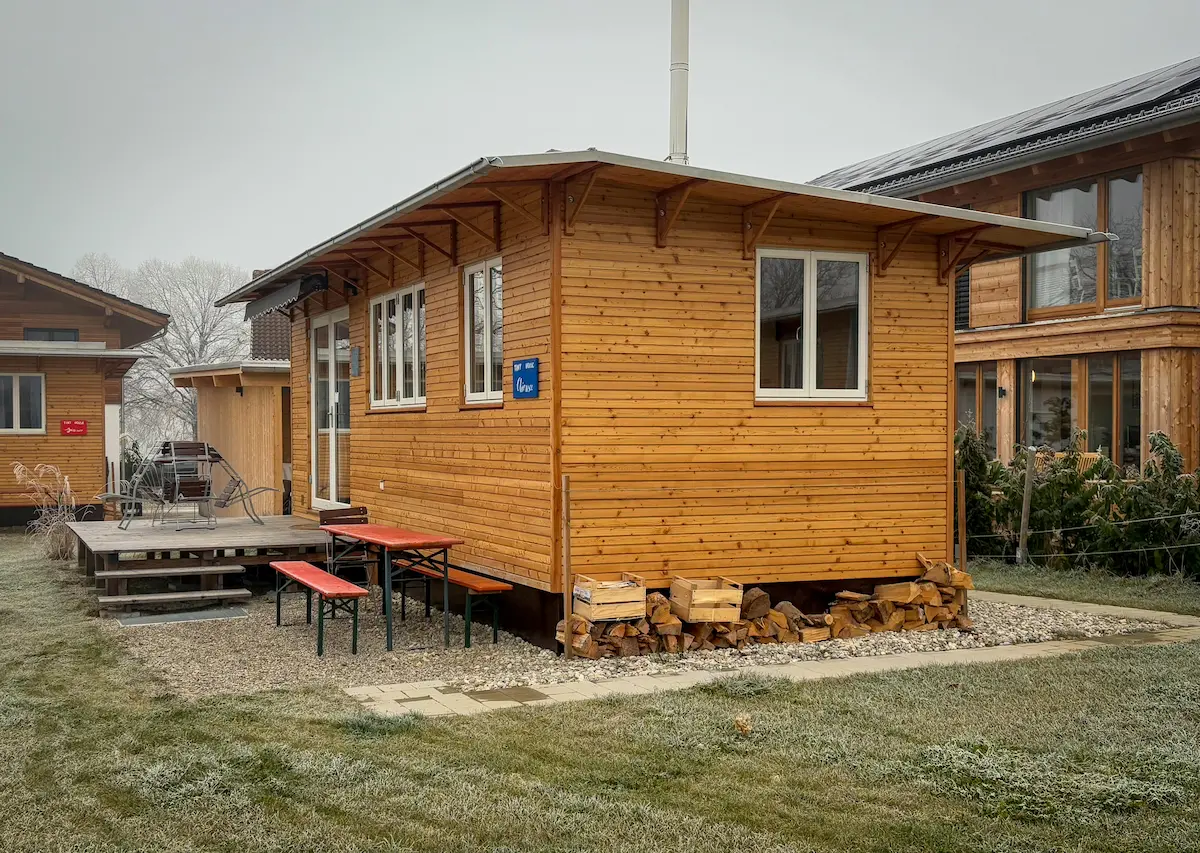 A prebuilt wooden small house with a simple, functional design.