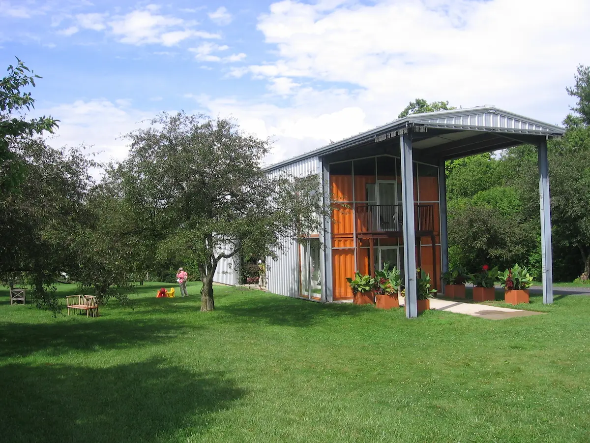 A prefabricated container transformed into a tiny house, designed for compact, modern living.