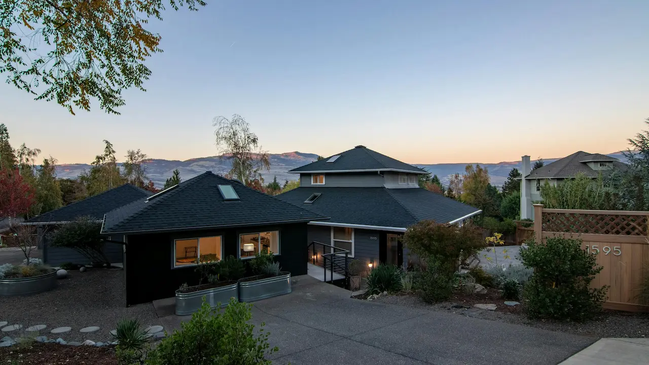 exterior design of a residential house featuring a classic hip roof style