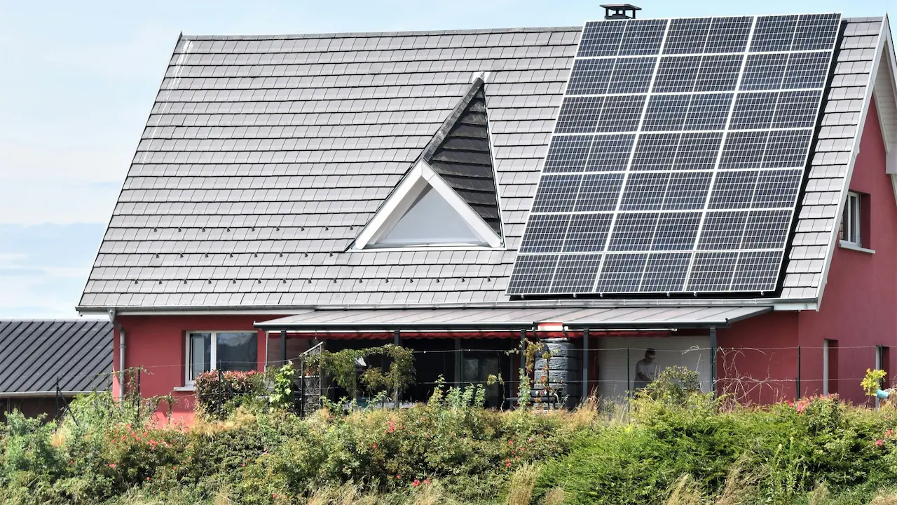 house in Seppois-le-Bas, France, with solar panels on the roof showcasing a commitment to sustainability