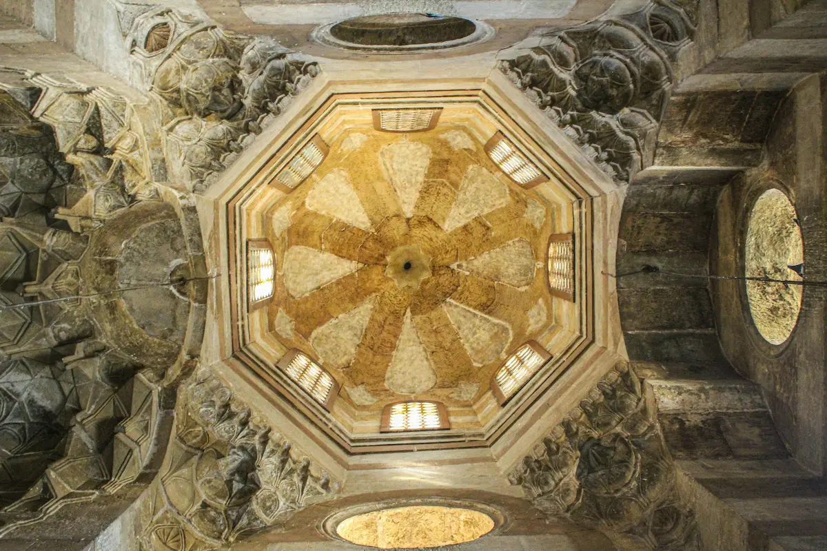 A shot directly below the ceiling in the Mosque-Madrasa of Sultan Barquq in Cairo, Egypt, showcasing its intricate architectural details.