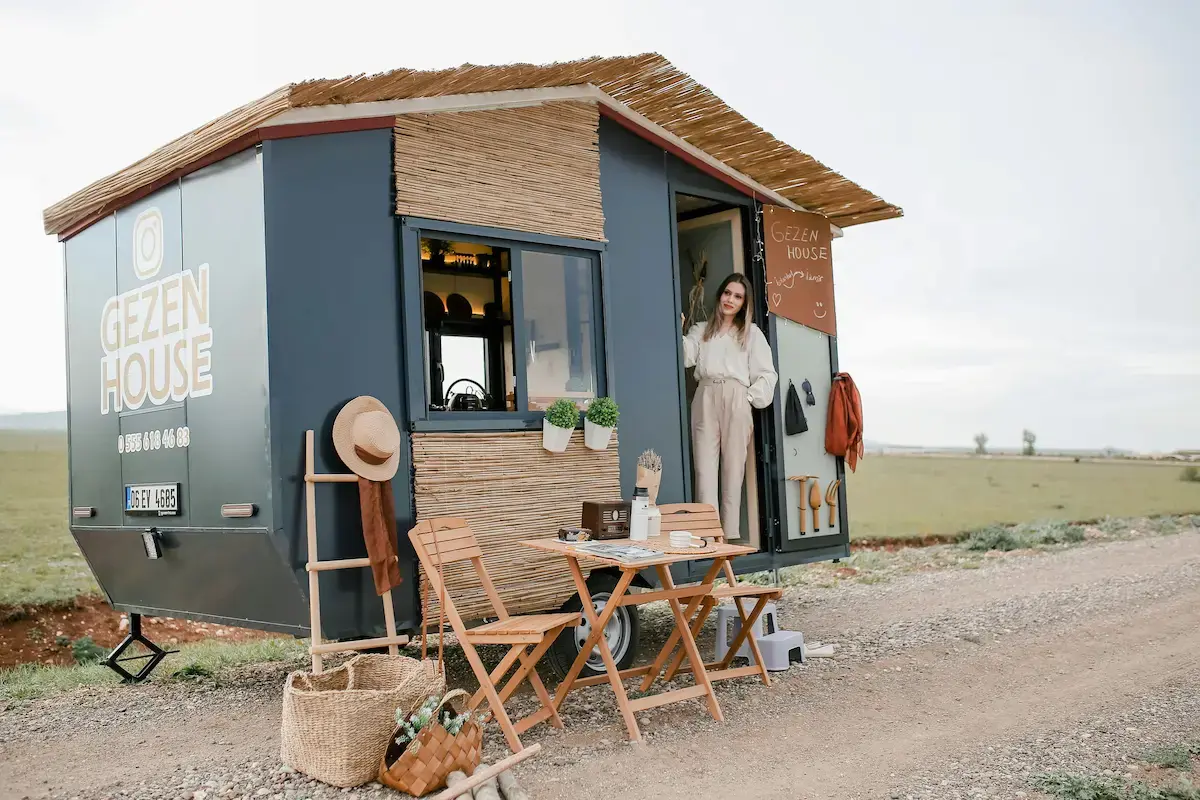 A trailer converted into a compact and stylish house on wheels, showcasing affordable housing solutions.