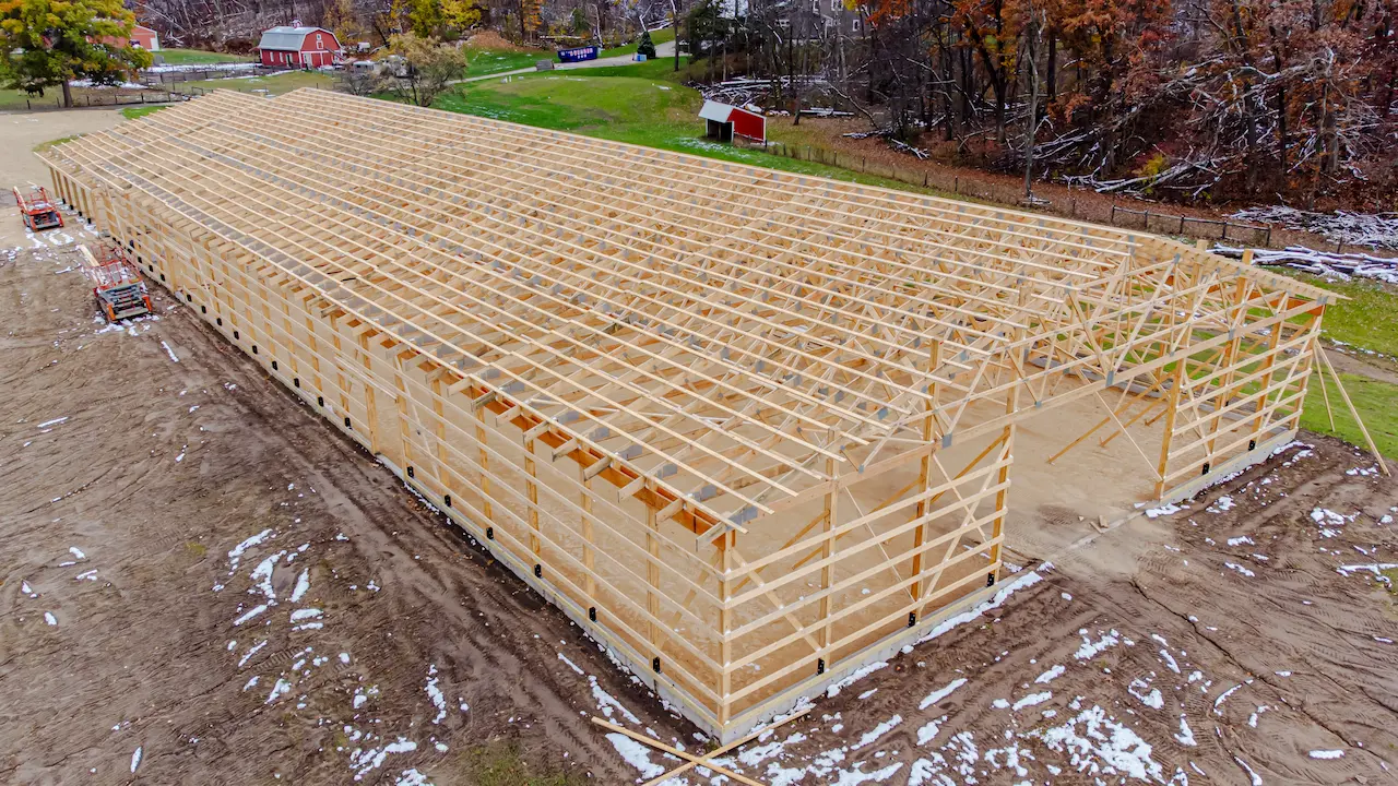 post-frame building with treated wood framing in progress