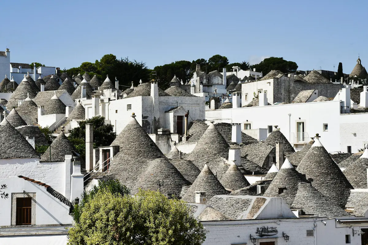 Traditional Trulli houses in Alberobello, Apulia, Italy, featuring iconic conical roofs.