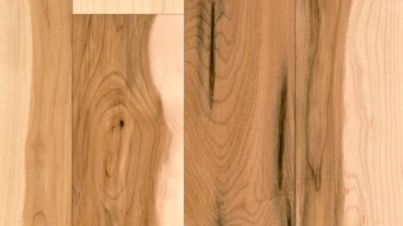 Maple wood floor displaying both sapwood and heartwood, highlighting natural grain contrast and smooth finish.