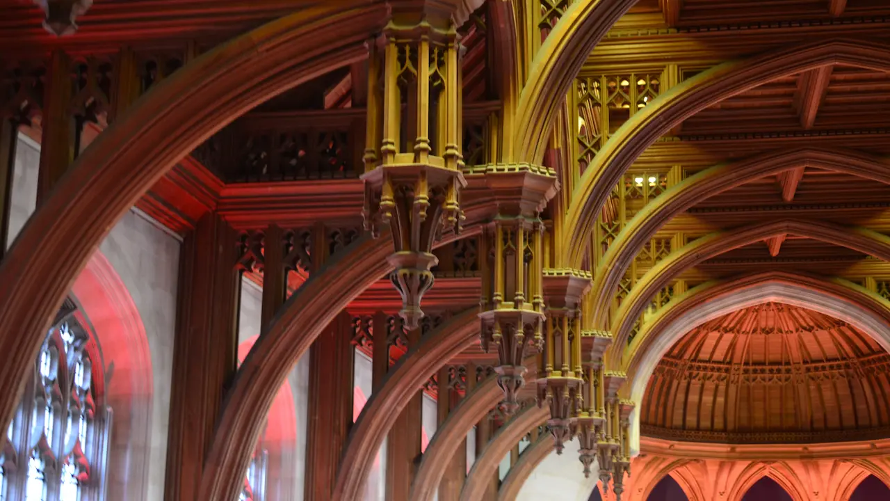 Ornamented hammerbeam roof with decorative pendants in the Great Hall of Wills Memorial Building, University of Bristol.