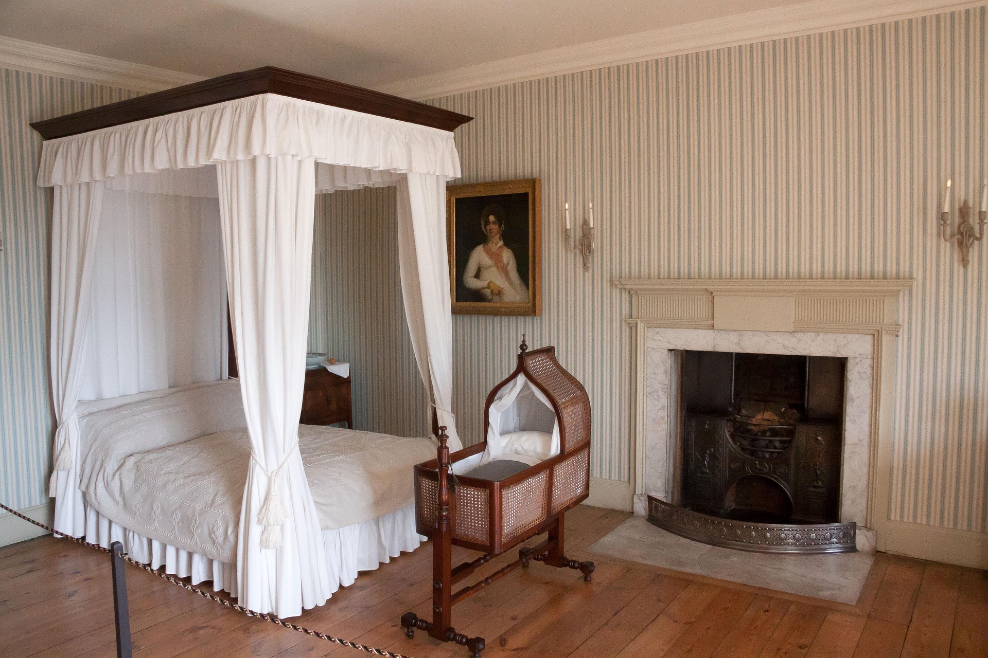 A Federal-style fireplace in a bedroom, featuring elegant moldings and classic architectural details.
