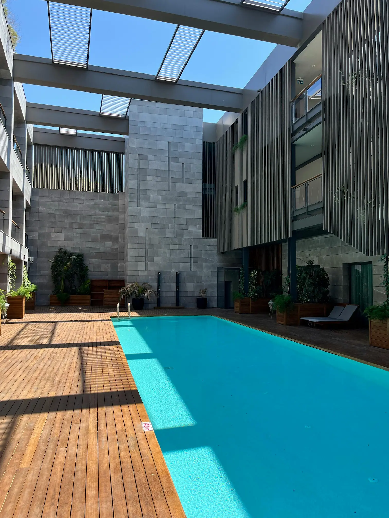 A modern design concept featuring a swimming pool at a patio, blending style and functionality.