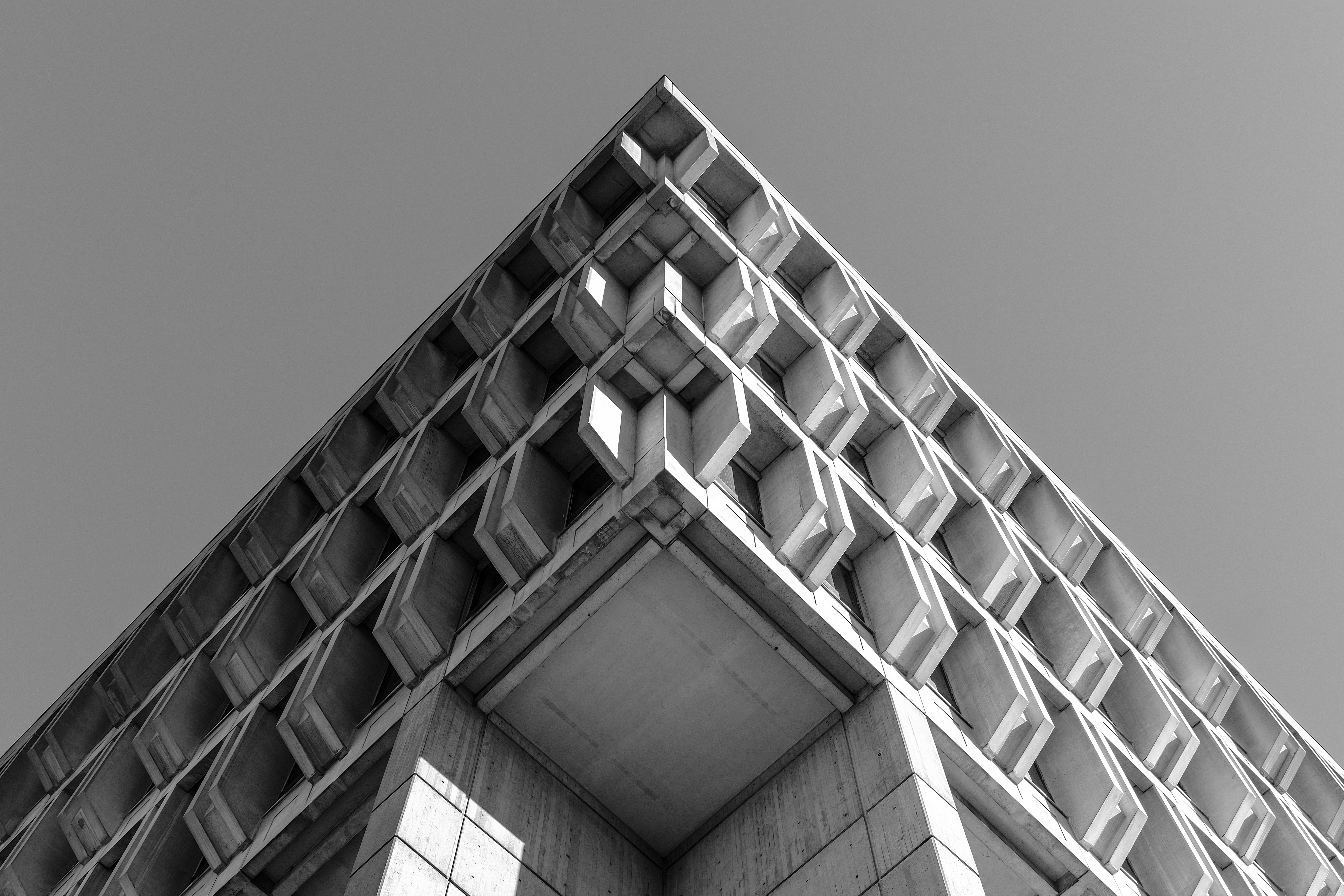 Grayscale photography of a modern 1940s concrete building in Boston, MA.