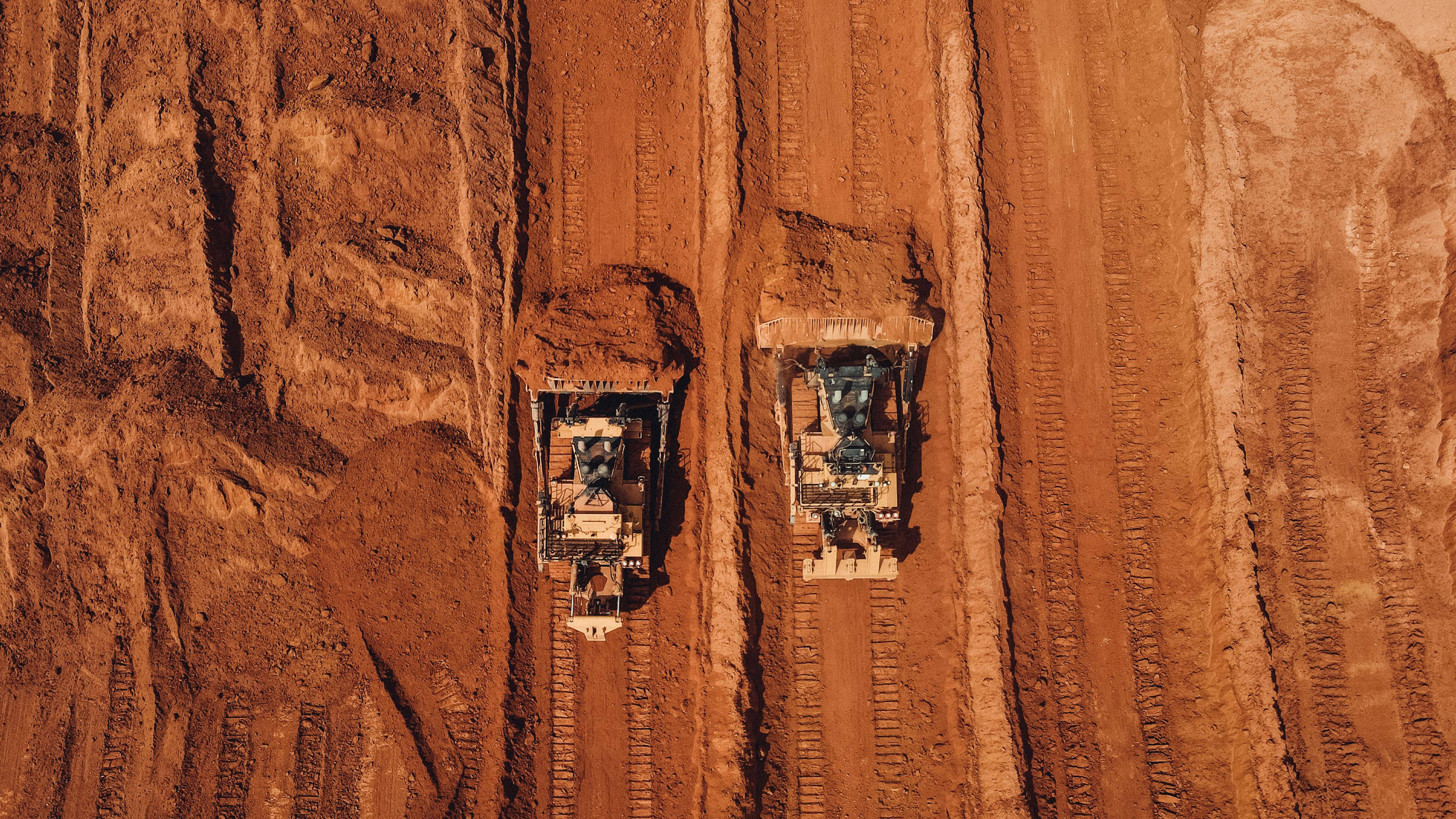 Aerial view of heavy machinery at work in Brazil, powered by AI technology.