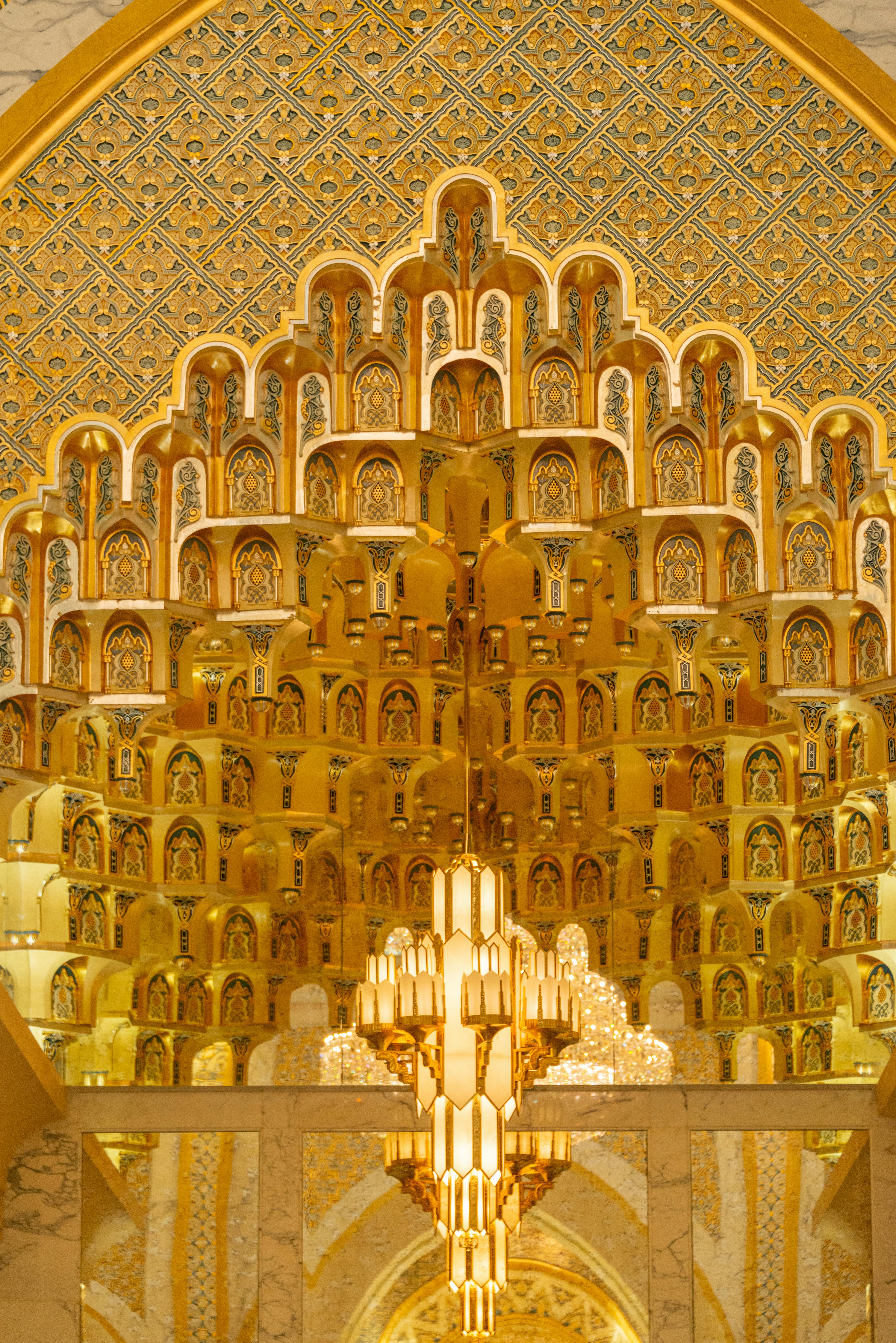 Luxurious Art Deco interior with gold accents, detailed patterns, and opulent palace decor.