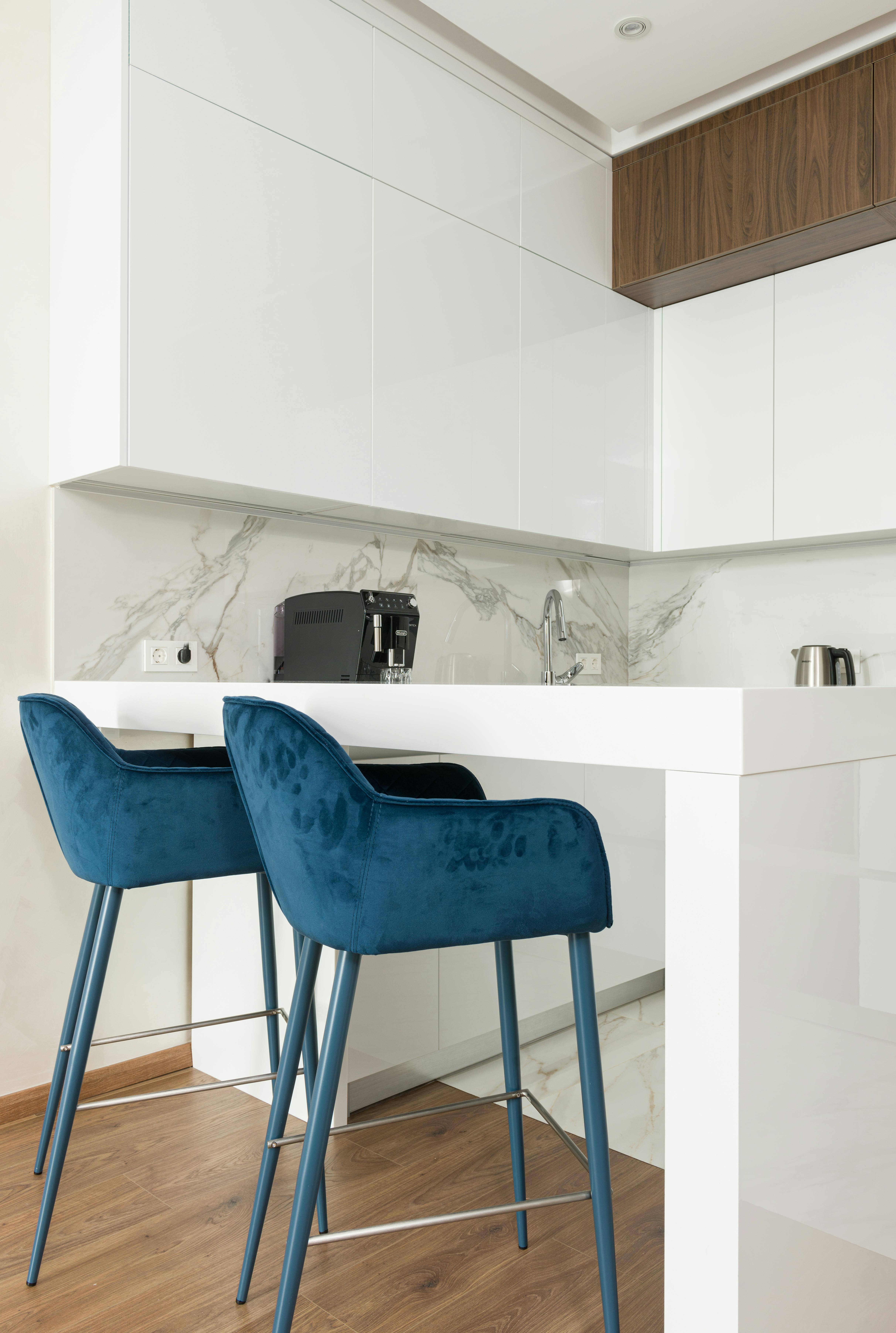 Navy-blue stools, cream cabinets