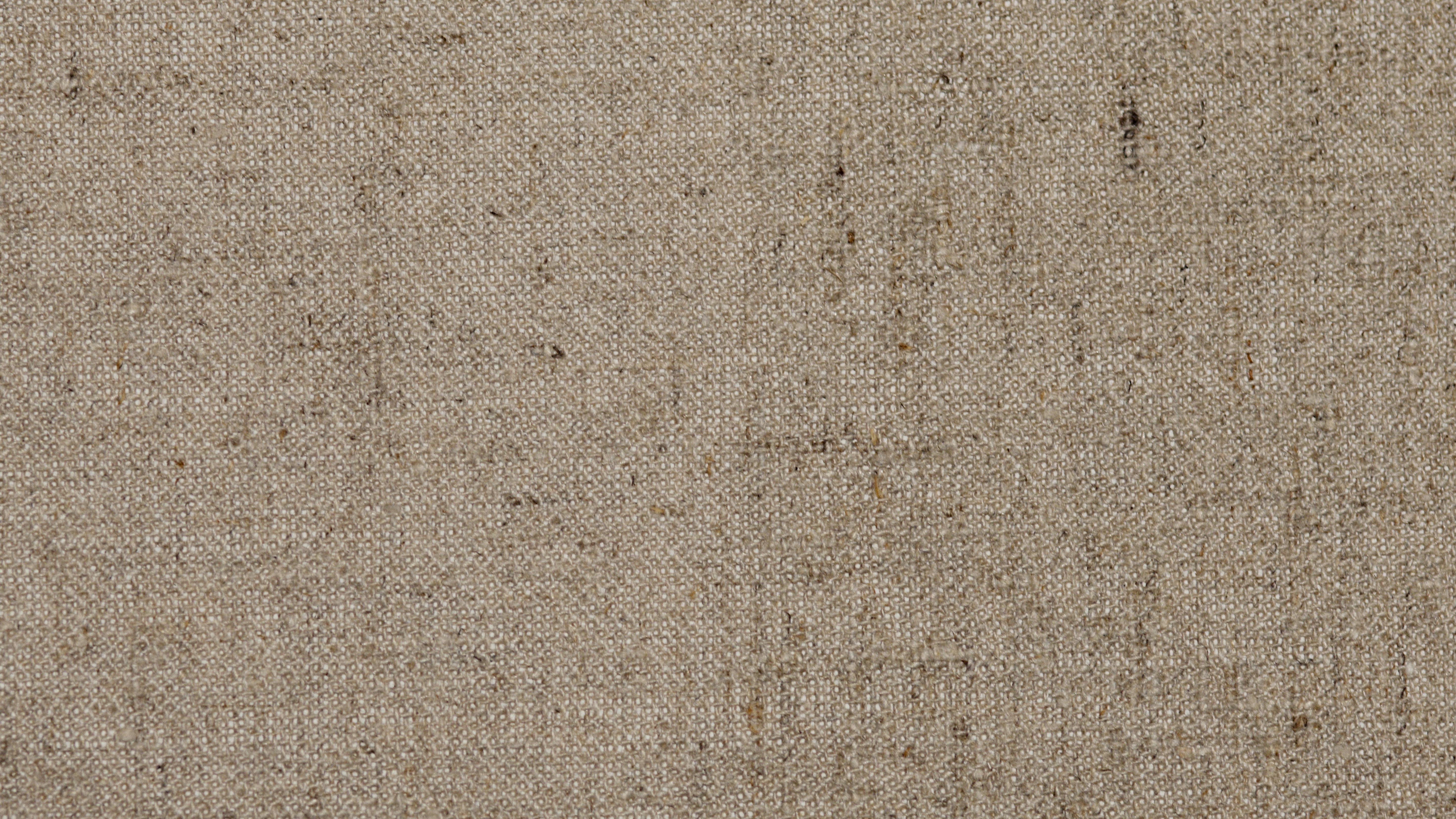 Burlap used as insulation in a building, showcasing its natural texture and breathable properties.