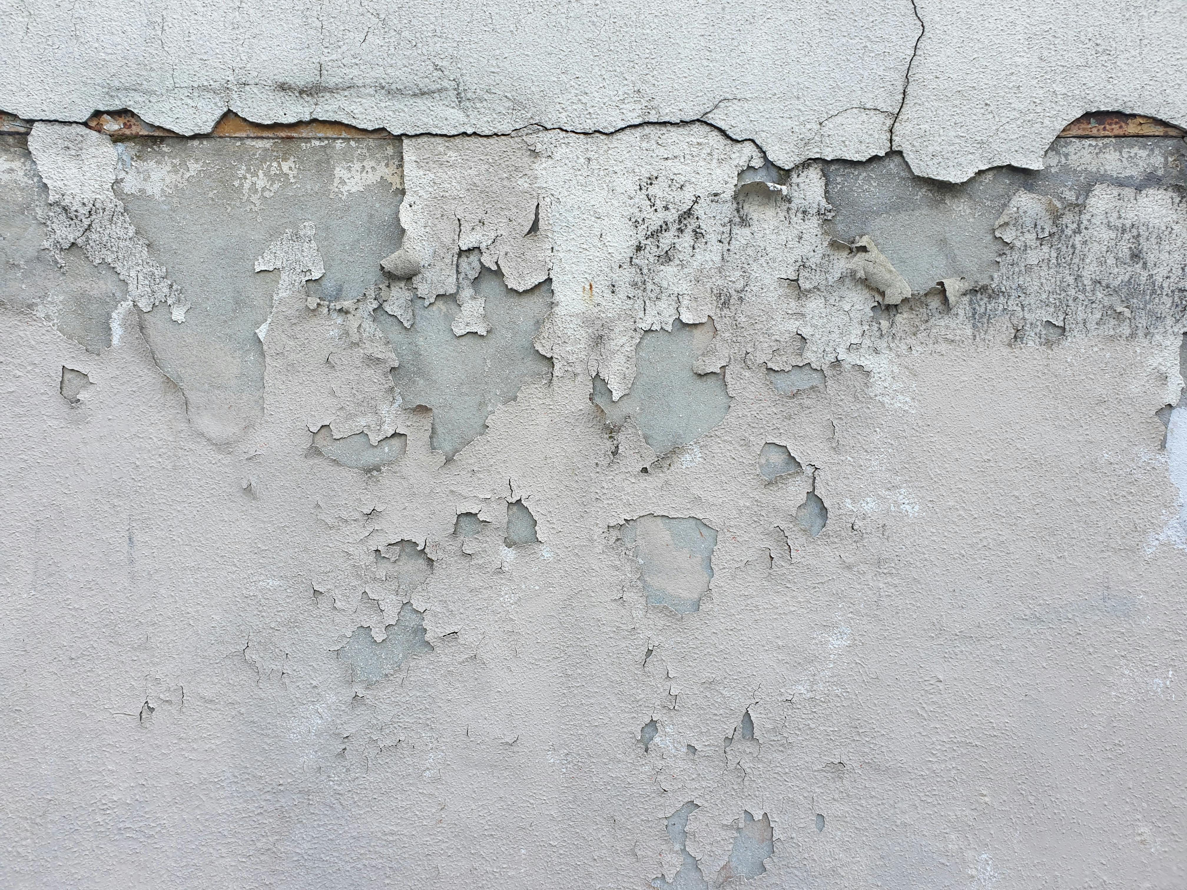 Concrete basement wall with water leakage caused by exterior moisture infiltration.