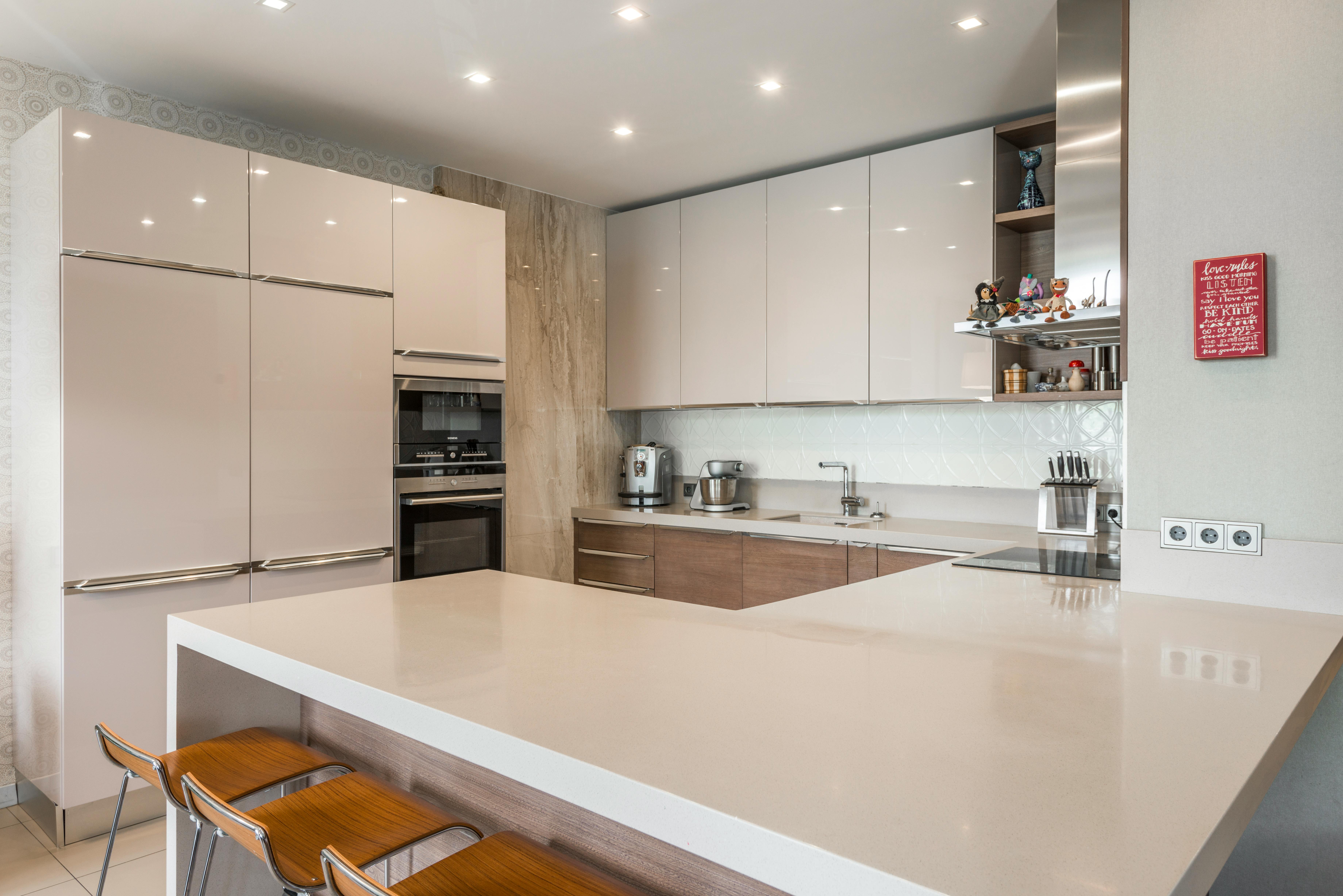 Cream-colored kitchen interior with modern and chic design elements.