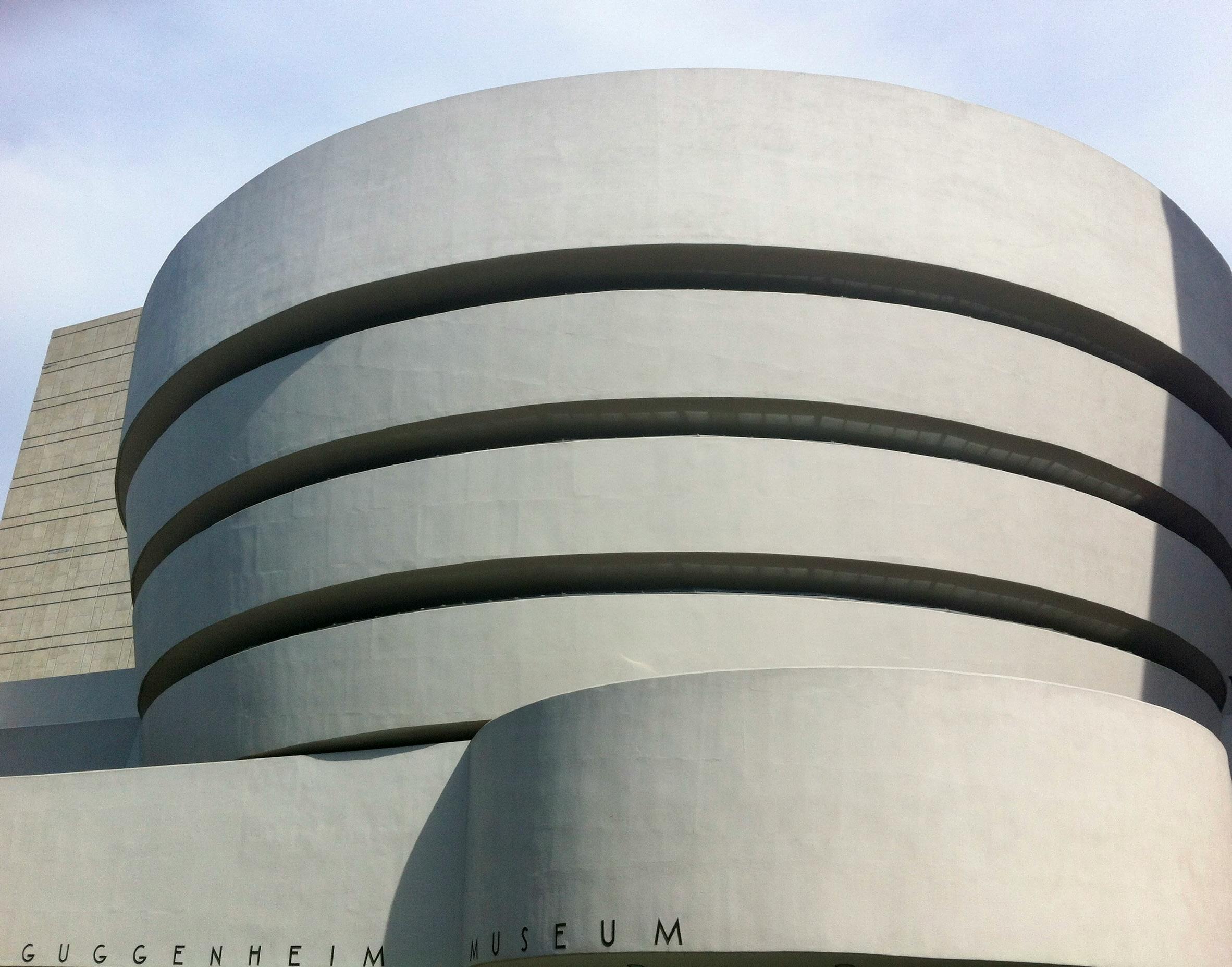 Facade of the Guggenheim Museum in New York, showcasing its free-form, spiraling architectural design.