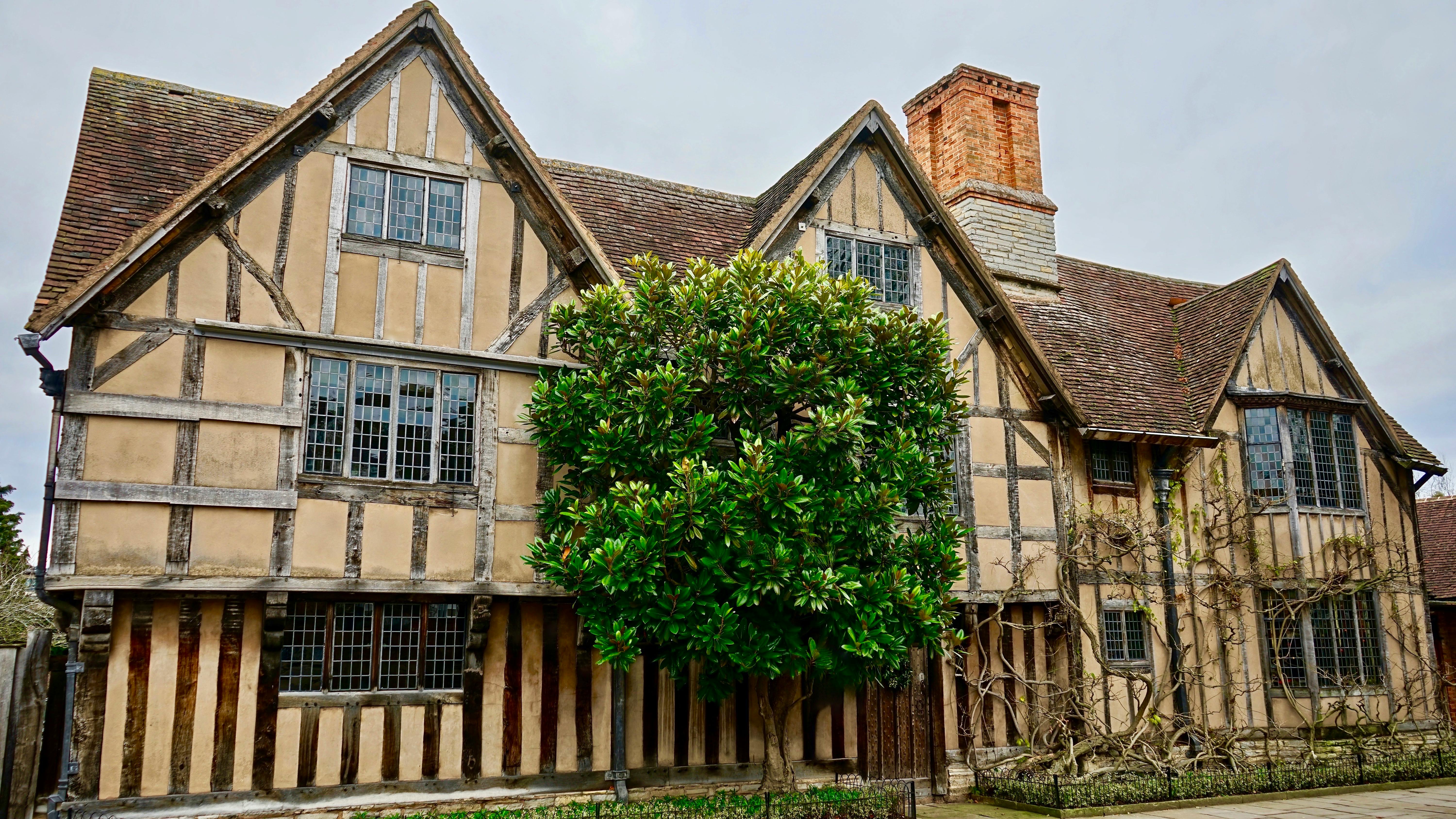 Weathered Tudor house with timber framing and brickwork