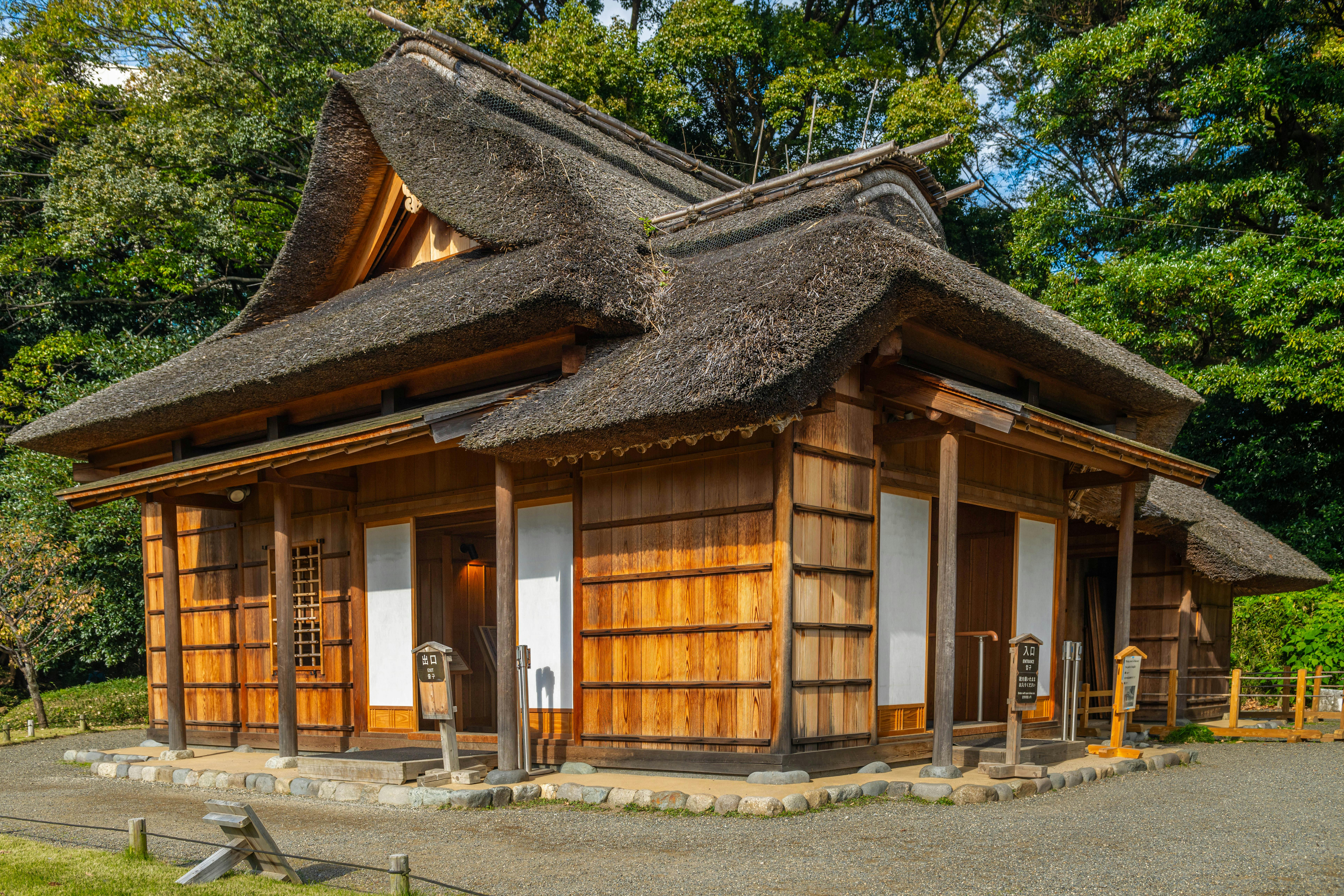 Traditional Japanese Minka house in a serene garden setting in Japan.