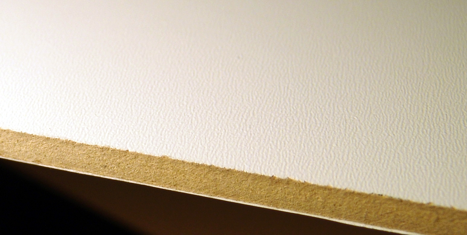 Low density fiberboard sample showing porous texture and lightweight construction.