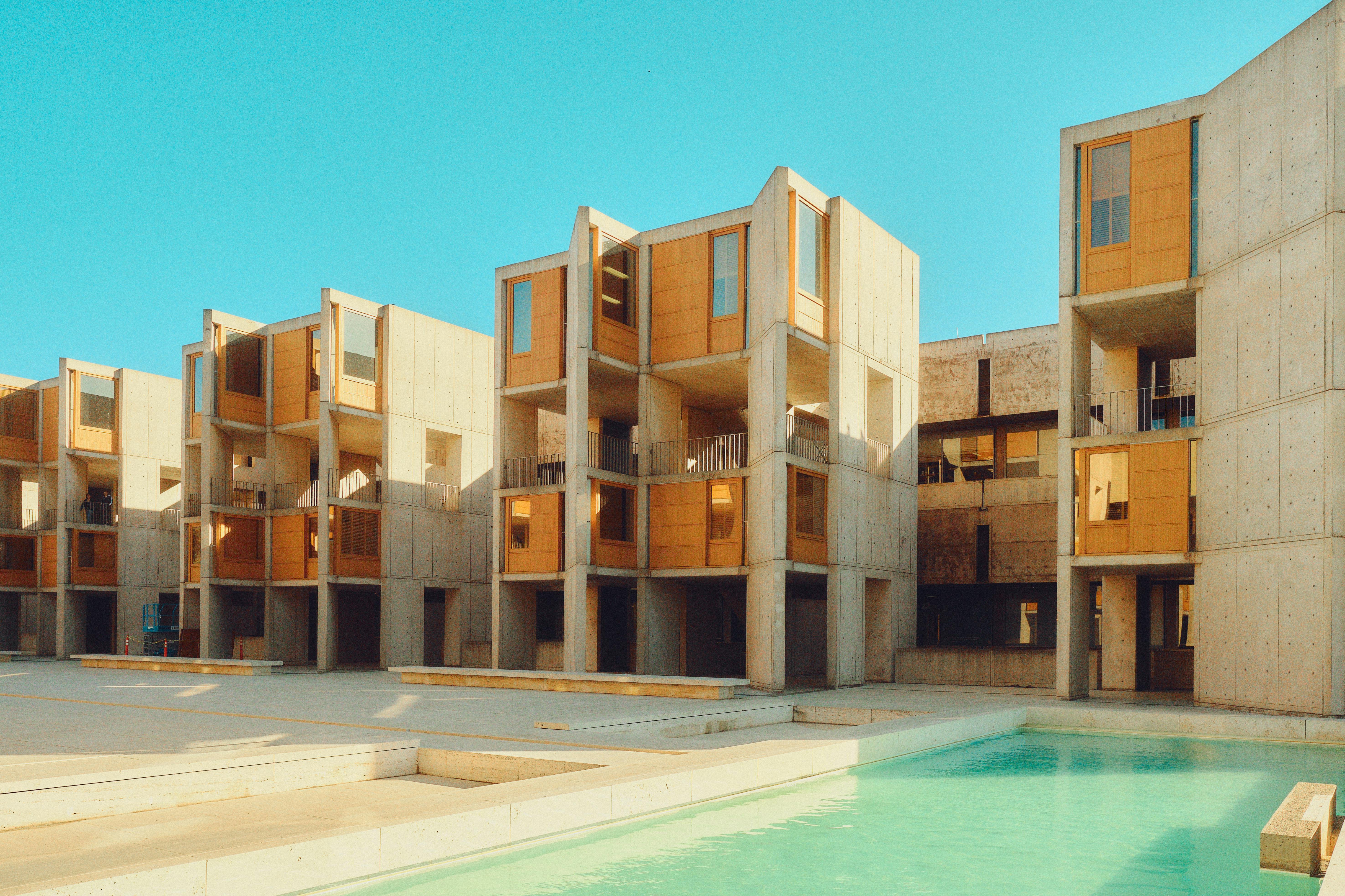 Modern Brutalist architecture of Louis Kahn’s Salk Institute in San Diego, featuring its iconic concrete structures and open courtyards.