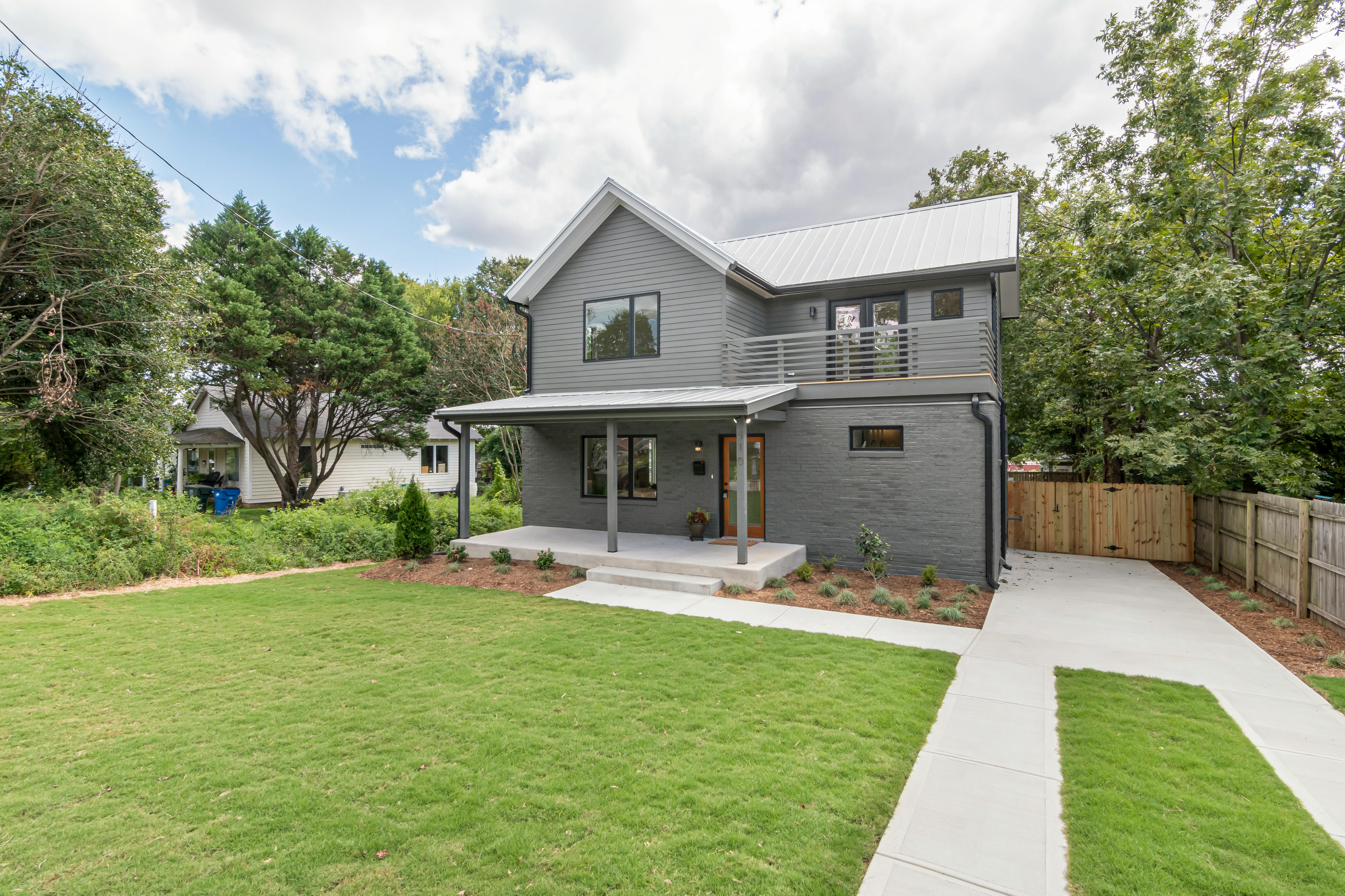 Medium-sized concrete house with modern design.