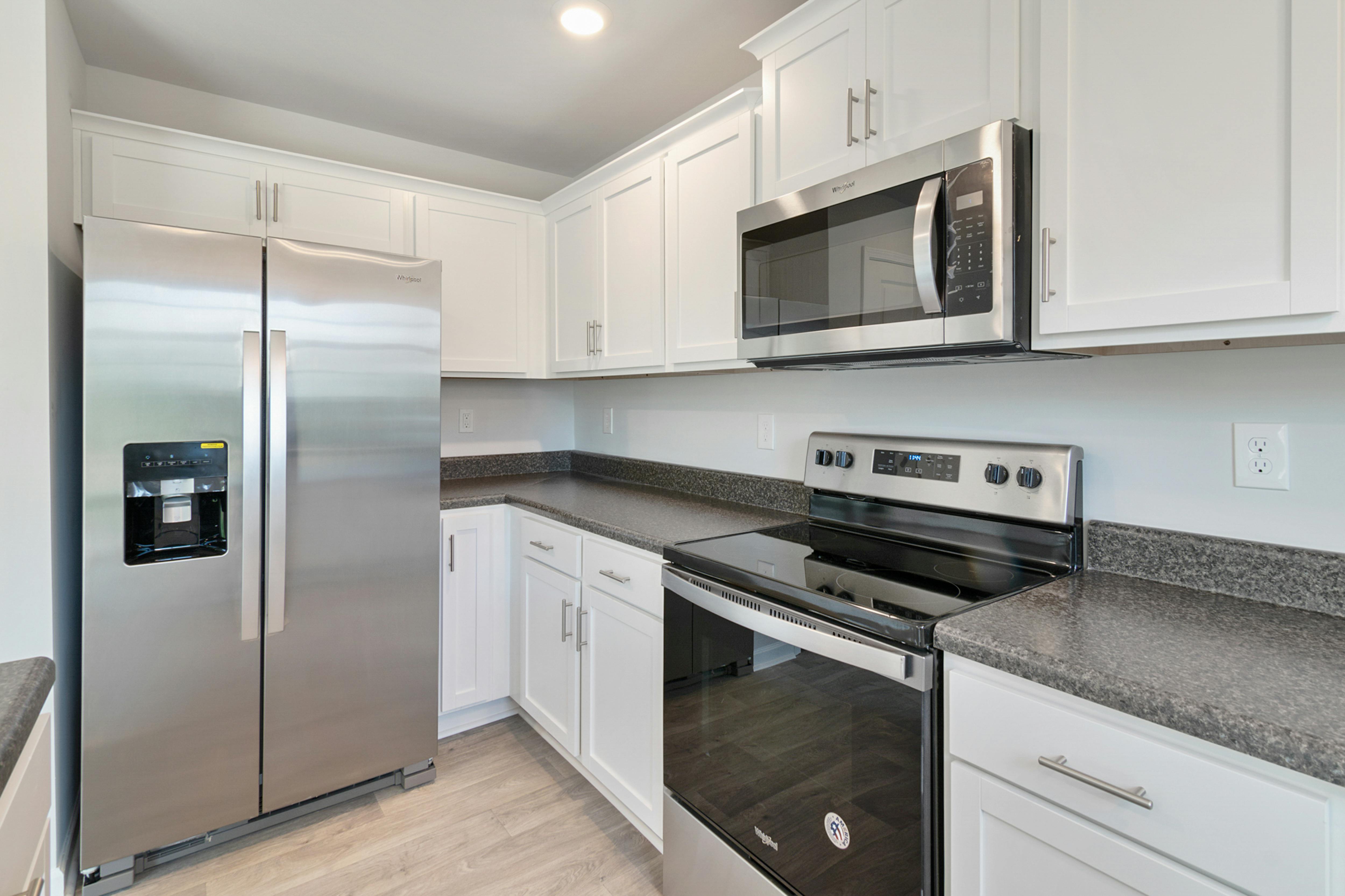 Modern kitchen with cream cabinets
